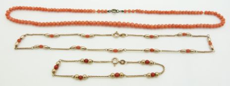 A 9ct gold necklace and bracelet set with coral beads and a coral necklace