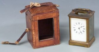 Late 19thC / early 20thC brass carriage clock in carriage style case, the Roman enamel dial with