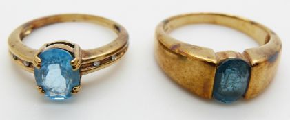 Two 9ct gold rings set with oval cut blue topaz, 8.7g