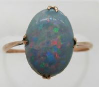 A 9ct gold ring set with an opal doublet, 1.5g, size N