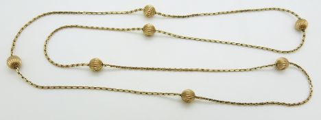 A yellow metal necklace with sphere decoration, 17.5g