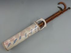 Two horn or similar handled walking sticks/canes, further walking stick and a ceramic stick stand