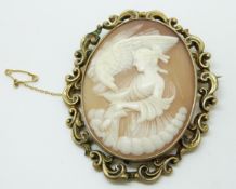 A large Victorian pinchbeck brooch set with cameo depicting a woman and an eagle, 6.8 x 5.5cm