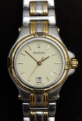 Gucci ladies wristwatch ref. 9040L with date aperture, gold hands and markers, cream dial, quartz