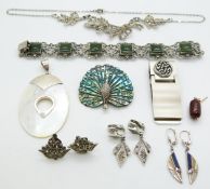 A silver bracelet set with nephrite jade, mother-of-pearl pendant, abalone brooch, marcasite etc