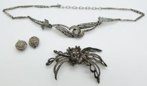 A silver necklace set with marcasite, earrings and brooch
