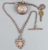 A hallmarked silver engine turned sovereign holder with hallmarked silver fob, watch key and