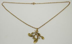 A gold pendant in the form of mistletoe set with pearls, on 9ct gold chain, 5.8g