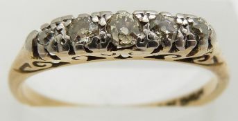 An 18ct gold ring set with five diamonds, 2.9g, size O/P