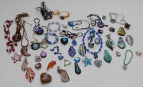 A large collection of glass pendants