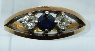 An 18ct gold ring set with a sapphire and two diamonds, 5g, size N
