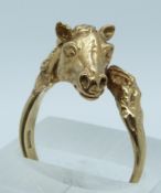 A 9ct gold ring in the form of a horse, 5.9g, size P