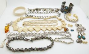 A collection of costume jewellery including Otazu necklace, silver pendants, pressed amber