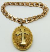 Victorian locket with textured background and cross decoration on gold plated bracelet