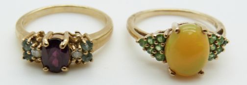 A 9ct gold ring set with a garnet and a 9ct gold ring set with an opal cabochon and tourmaline, 5.8g