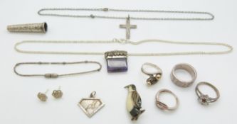 A collection of silver jewellery including enamel penguin brooch, four rings, necklaces etc