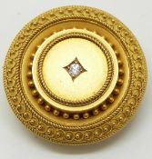 Victorian yellow metal Etruscan Revival brooch set with a diamond, 3cm diameter