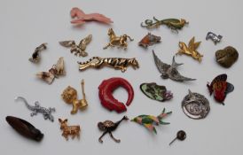 A collection of brooches including enamel and marcasite horse, lizard, enamel frog, Sphinx horse,