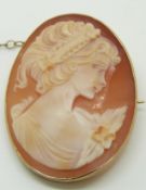A 9ct gold brooch set with a cameo of a young woman, 3.7 x 2.7cm