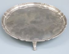 George V hallmarked silver salver with shaped edge, raised on three feet, Sheffield 1925 maker's