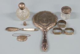 Three hallmarked silver napkin rings, weight 37g, hallmarked silver Sherry bottle label, silver