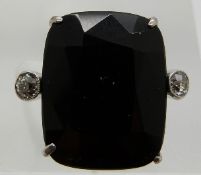 A platinum ring set with a cushion cut quartz and two old cut diamonds, 3.7g, size M
