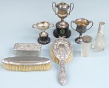 Three various hallmarked silver twin handled trophy cups, two on stands, weight of all three 180g