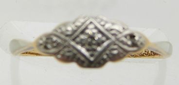 An 18ct gold ring set with diamonds in a platinum setting, 1.6g, size L