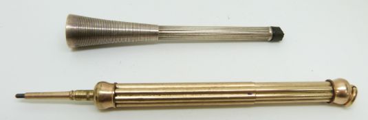 A propelling pencil and a silver cheroot holder