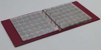 An amateur collection of UK coinage, George V onwards, very small silver content, in an album