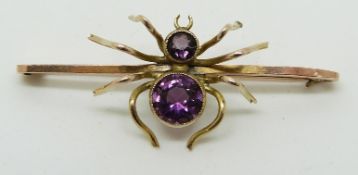 A 9ct gold brooch set with amethysts in the form of a spider, 4 x 1.5cm