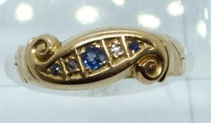 An 18ct gold ring set with sapphires and diamonds by A W C & Co, 2.6g, size O