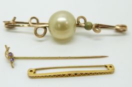 A 9ct gold brooch, a 9ct gold stick pin set with amethyst (2.2g) and a gold plated brooch