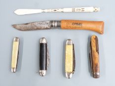Five folding knives including an Opinel example and a carved bone pen