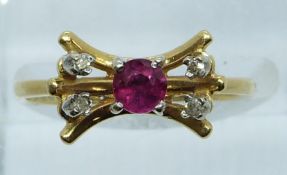 An 18ct gold ring set with a ruby and diamonds, 3.3g, size M/N