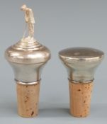Two modern hallmarked silver bottles stoppers, one with golfer to top