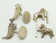 A pair of silver cufflinks in the form of dogs and a pair of white metal kukri cufflinks