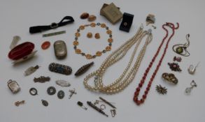 A collection of costume jewellery including silver brooches, enamel brooch, shell purse, Art Deco