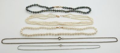 Three cultured pearl necklaces and a silver chain