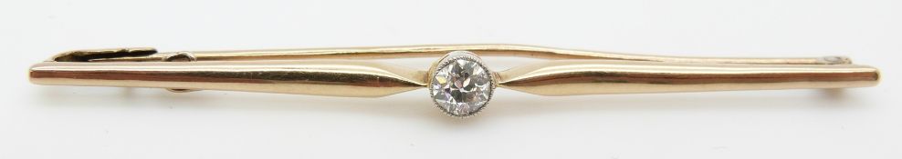 A 9ct gold bar brooch set with an old cut diamond of approximately 0.2ct