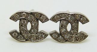 A pair of 9ct white gold earrings in the Chanel logo, 0.8g