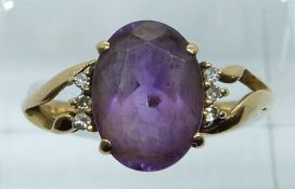 A 9ct gold ring set with an amethyst and diamonds, 3.2g, size Q/R