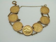 A 9ct gold bracelet set with seven half sovereigns, 1905, 1908, 1908, 1905, 1910, 1910, 1911, 38g