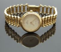 Omega De Ville gold plated ladies wristwatch ref. 1455 with gold hands, champagne dial and quartz