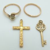 A 9ct gold ring set with a diamond, a 9ct gold ring and a 9ct gold cross, 5g