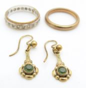 A 9ct gold eternity ring, a 9ct gold wedding band/ ring and a pair of 9ct gold earrings, 6.5g