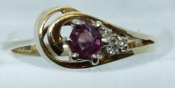 A 9ct gold ring set with a ruby and diamonds, 3g, size M