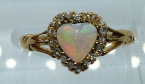 Victorian 18ct gold ring set with a heart cut opal surrounded by rose cut diamonds, Chester 1899,