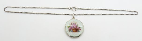 A silver locket set with blue guilloché enamel, 3cm diameter