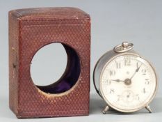 Ansonia c1900 8-day travel clock in silvered drum style case, the enamel Arabic 5.5cm dial with